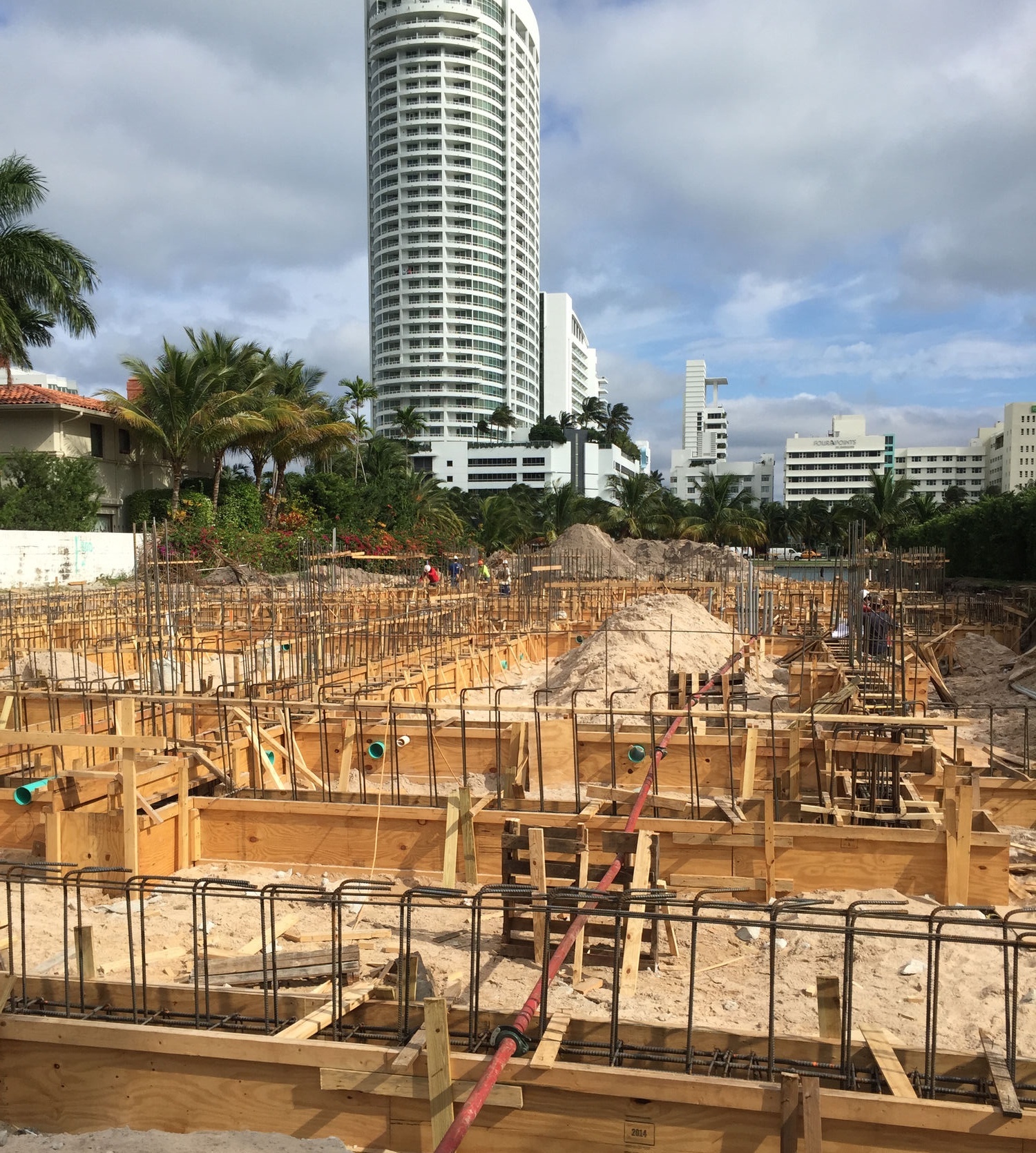 November 2014. The lot I knocked on, at foundation. Formwork, rebar, and sand, before any of it looked like a house. David Hunt Solomon.