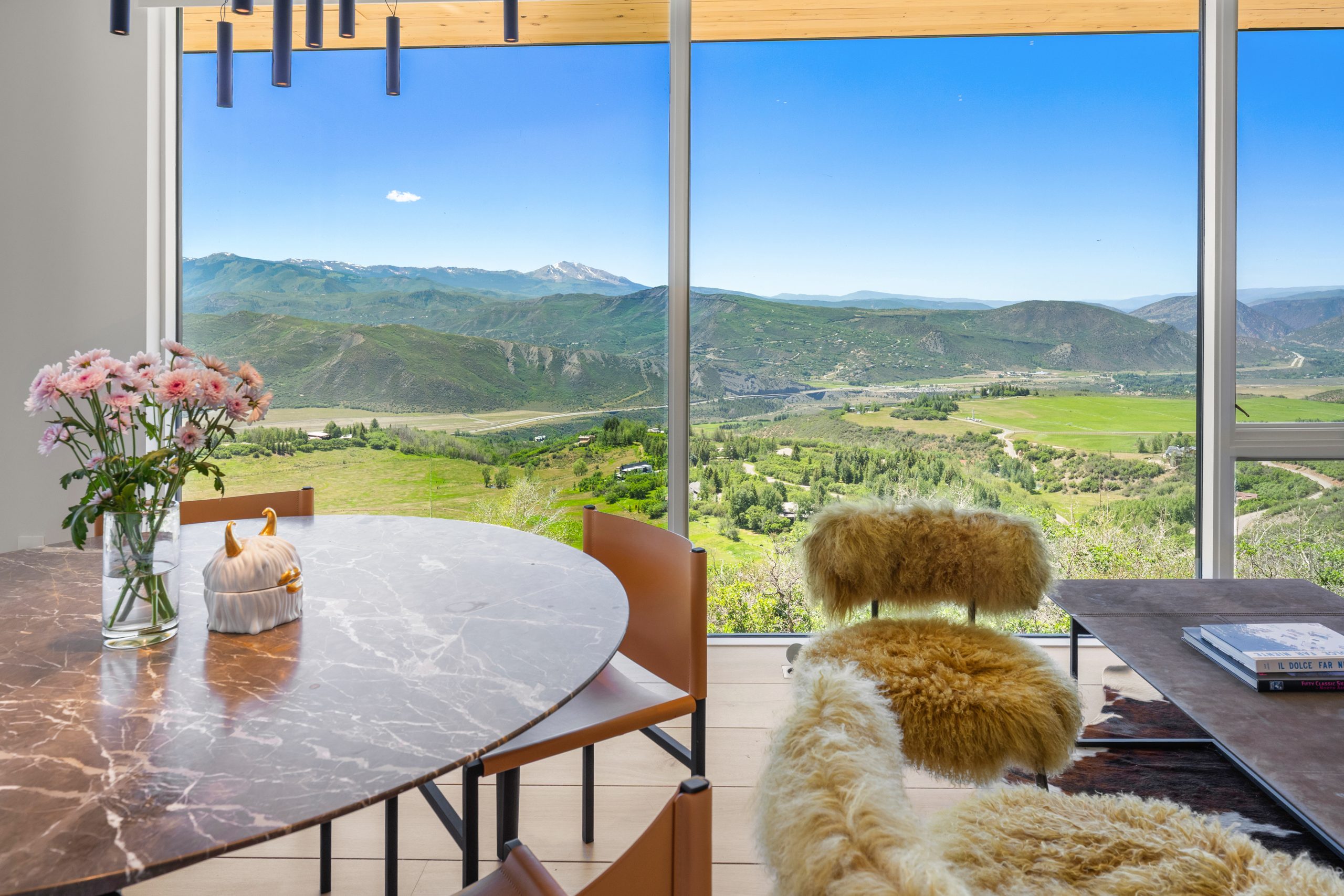 Dining, with the glass wall pointed down the valley.