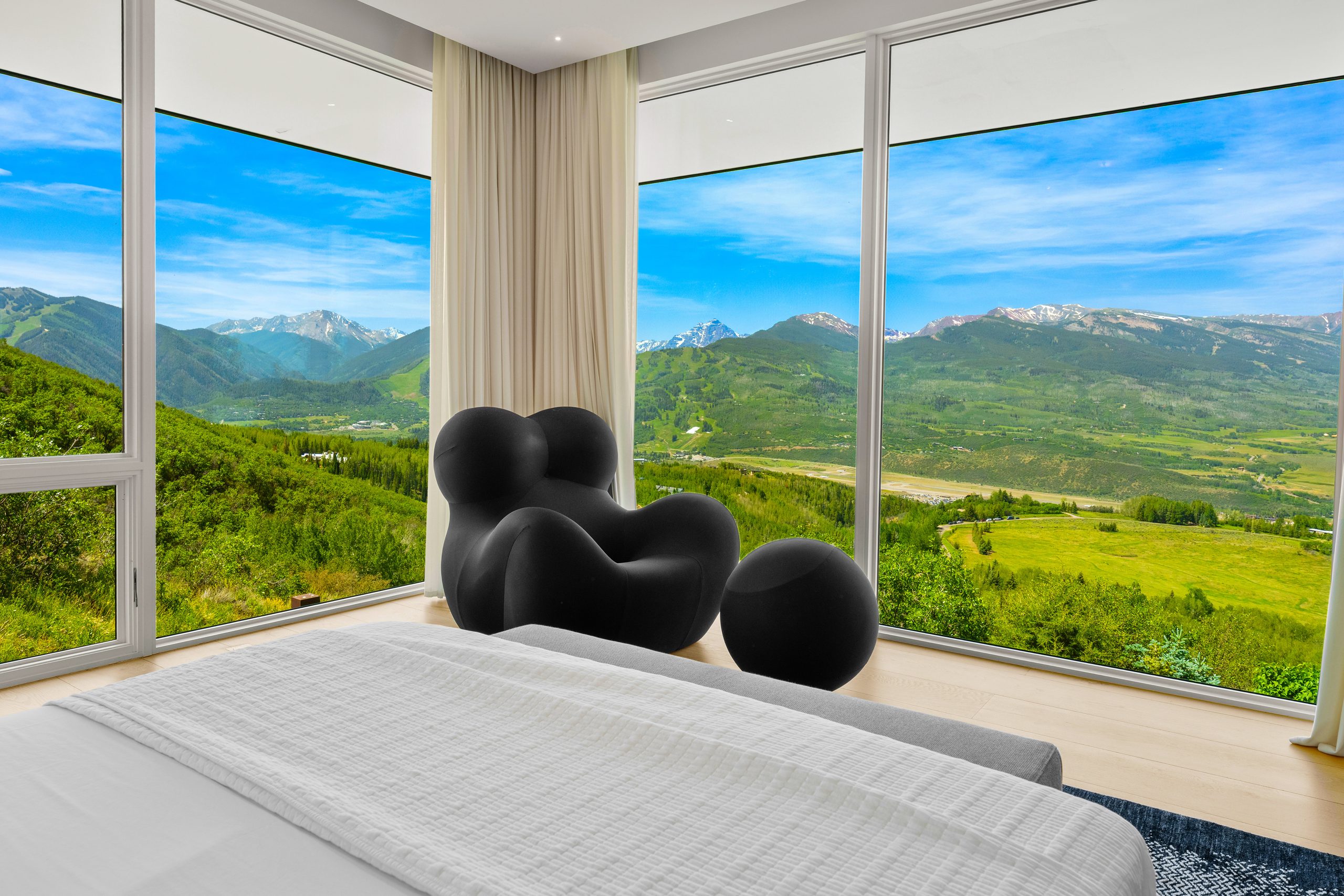 The primary suite, glass on two sides.