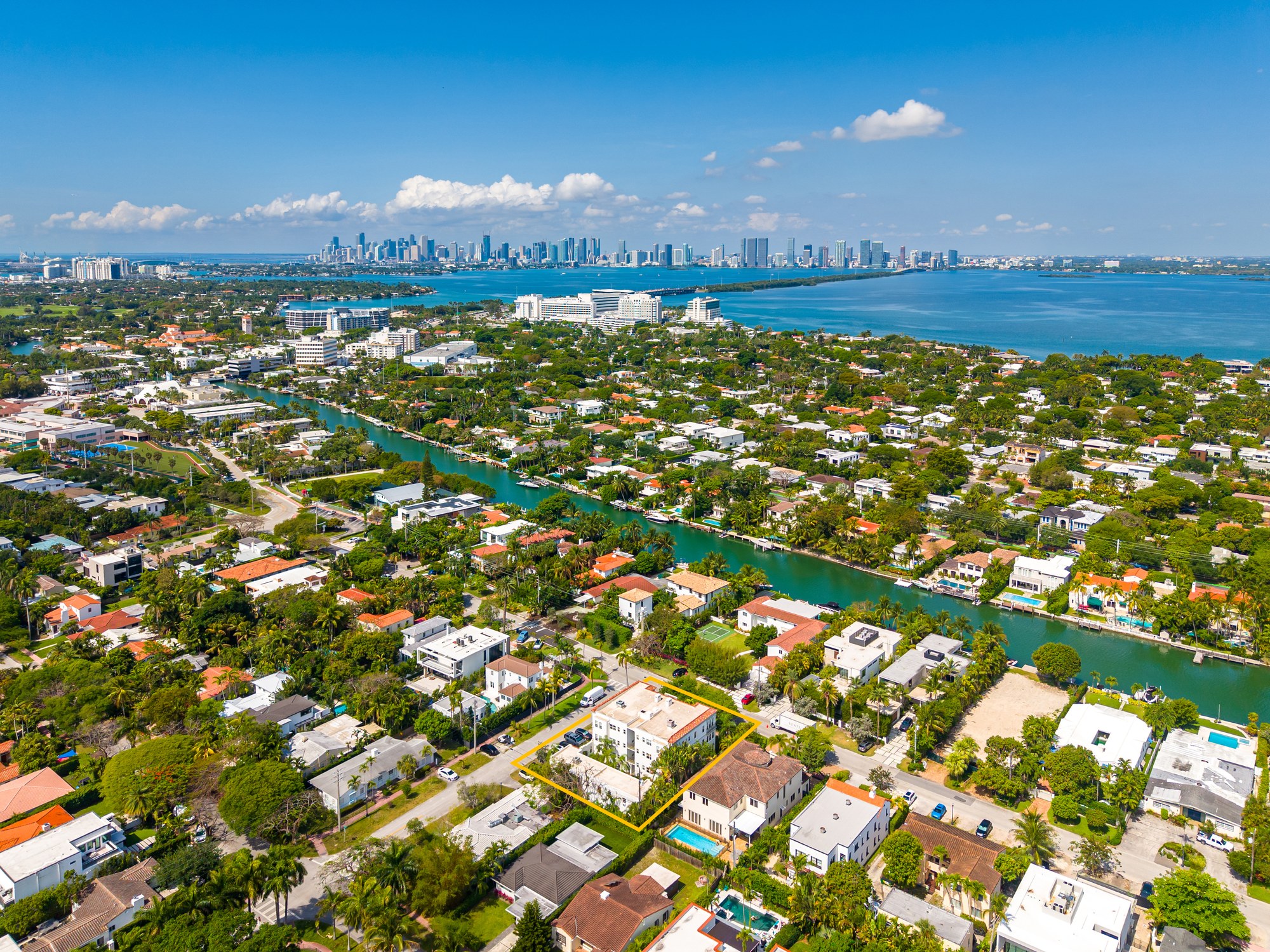 4501 Prairie Avenue, looking west — Indian Creek Canal, downtown Miami across the bay. Three blocks from the Miami Beach Golf Club, four blocks from Bayshore Park, ten minutes from Lincoln Road and the beach.