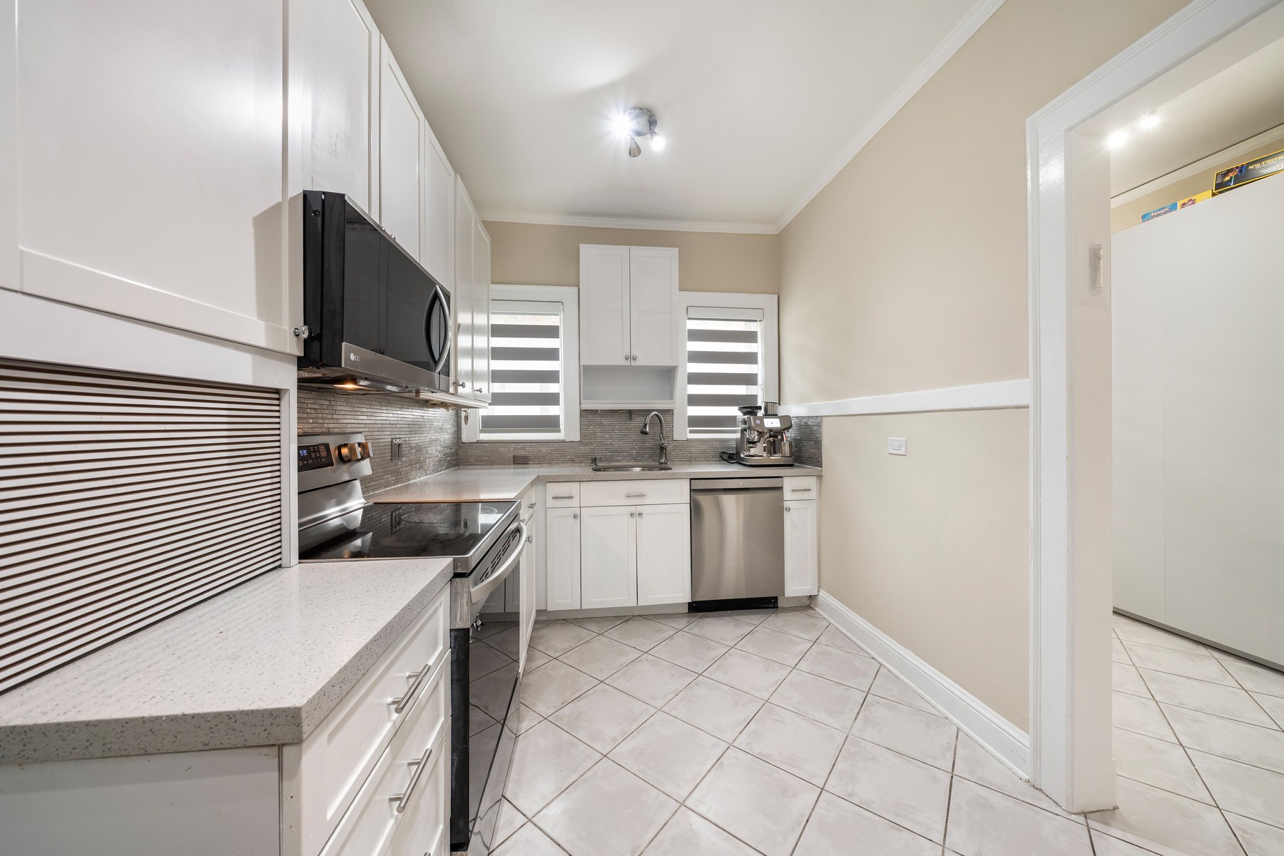 The kitchen with new appliances and looking through to the breakfast/flex room.