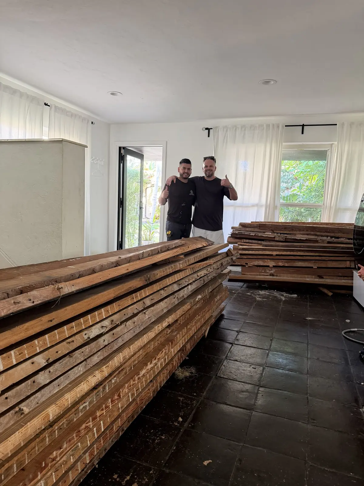 Gutting the house to salvage the original Dade County pine — wood this rare doesn't get thrown away.