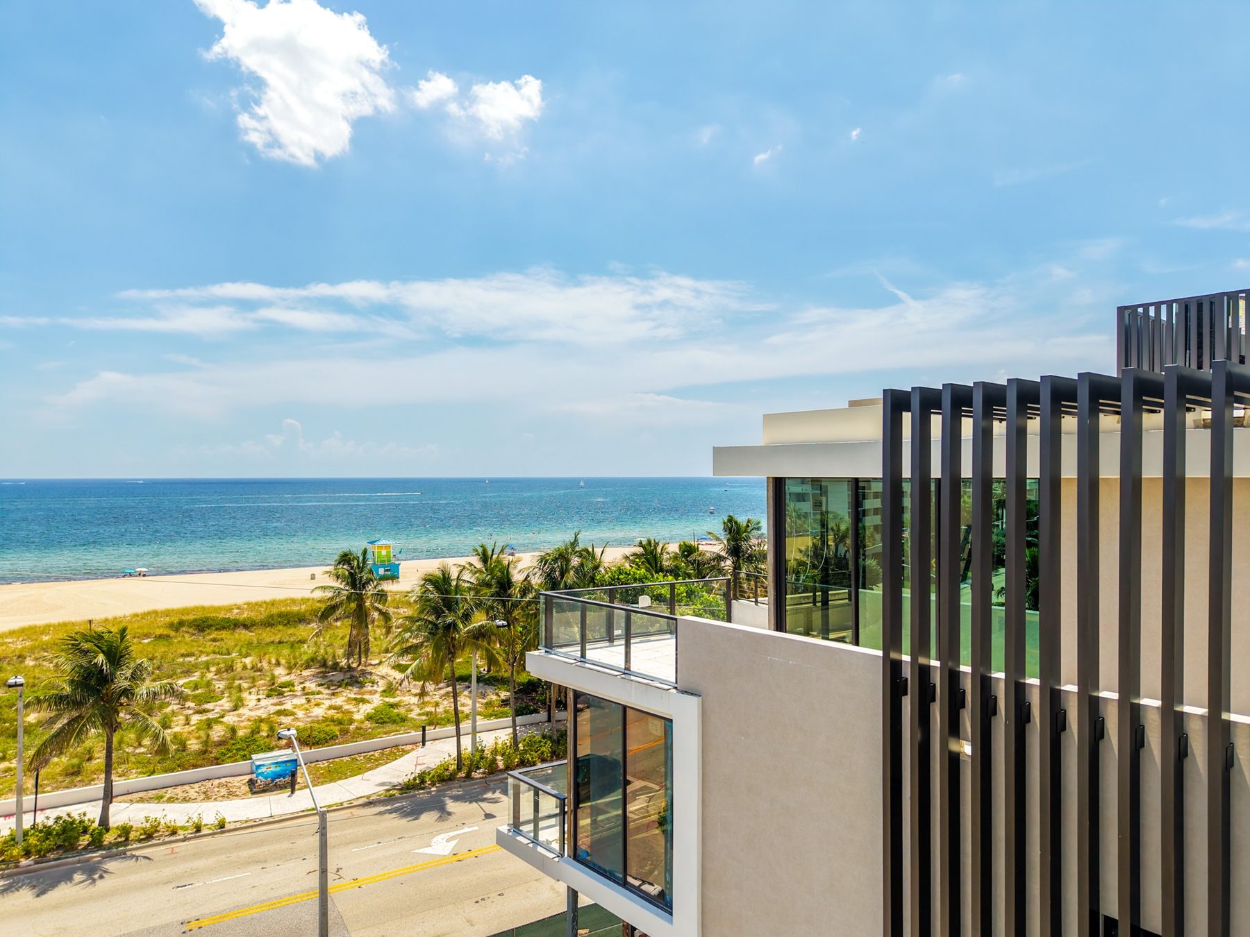 Louvered facade of Finesse with the beach beyond